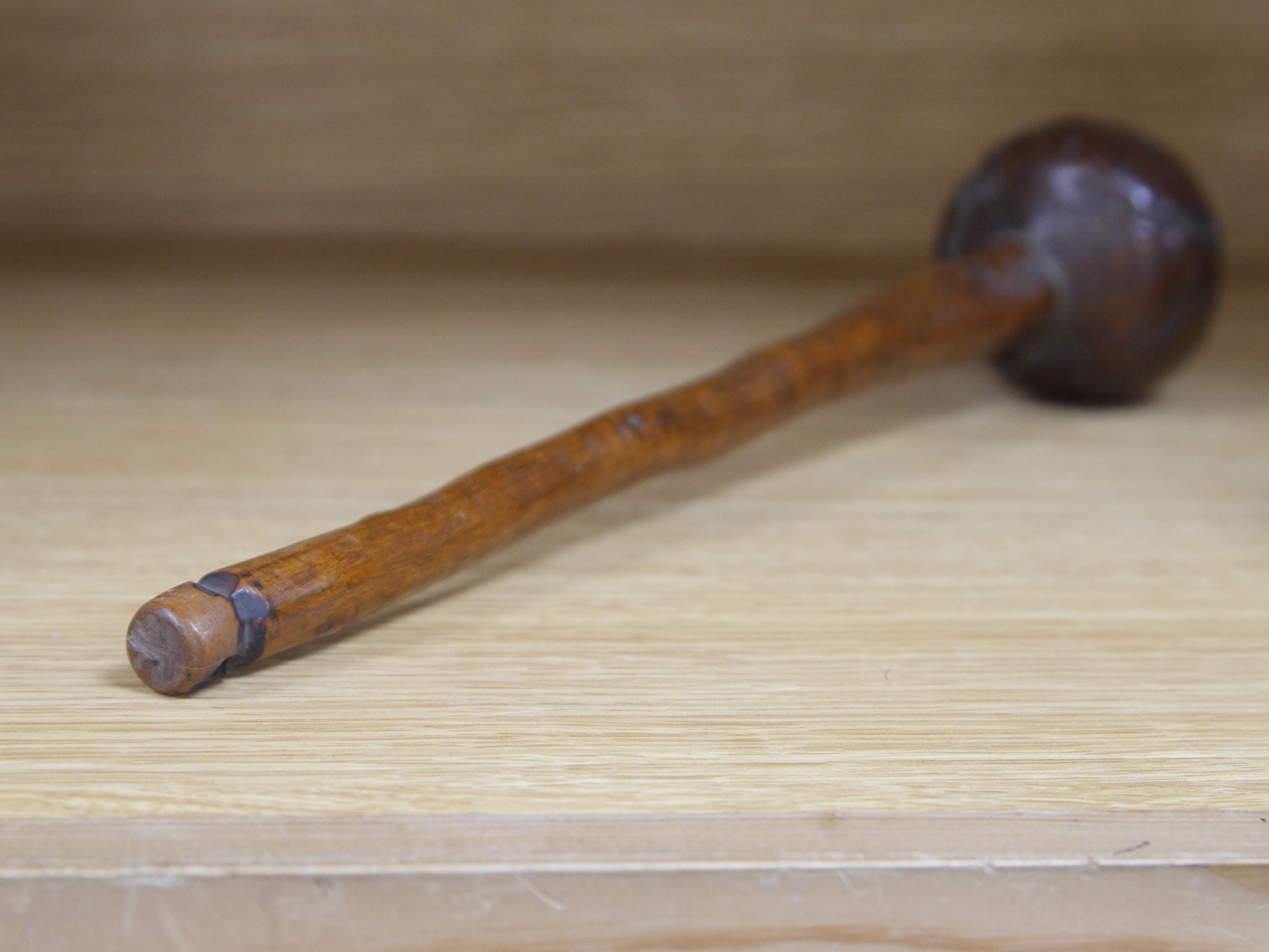 An African hardwood throwing club, Knobkerrie, 35cm in length. Condition - good